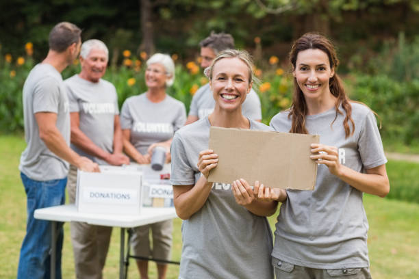 istock Happy volunteer family holding donation boxes 813461074