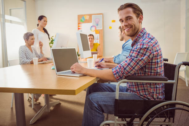 istock Creative casual businessman in wheelchair 813461180