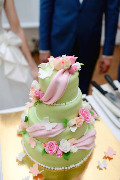 istock Beautiful wedding cake for bride and groom indoors 813464482