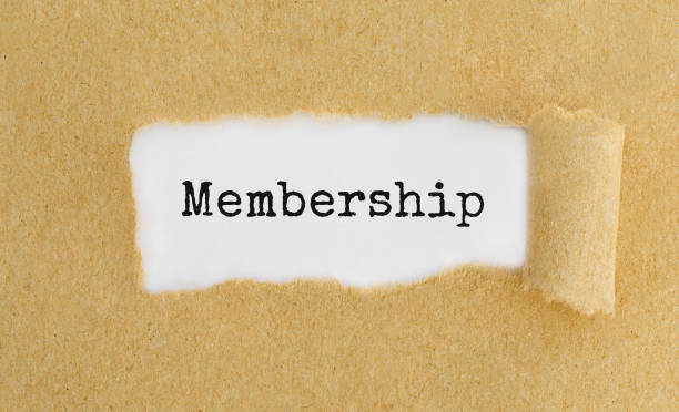 istock Text Membership appearing behind ripped brown paper 813480962