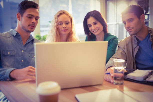 istock Group of young colleagues using laptop 813510396
