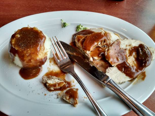 slices of turkey with mashed potatoes and gravy