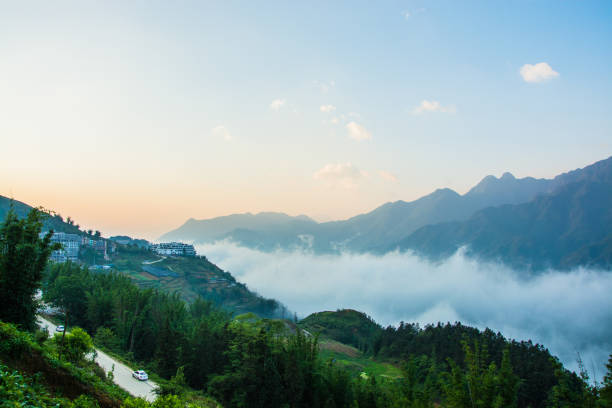 istock Blue morning skies above valley in sapa holding clouds 813520410