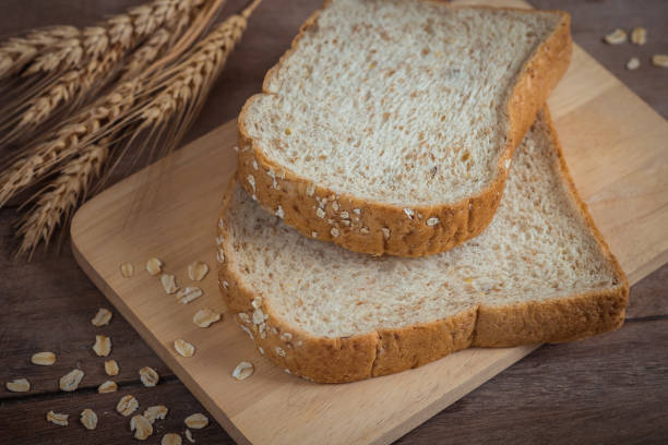 istock Whole wheat bread on wooden plate 813522988