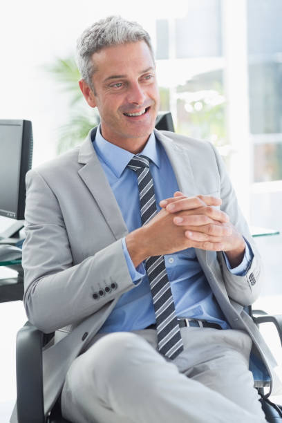 istock Thoughtful businessman sitting on a chair 813530676