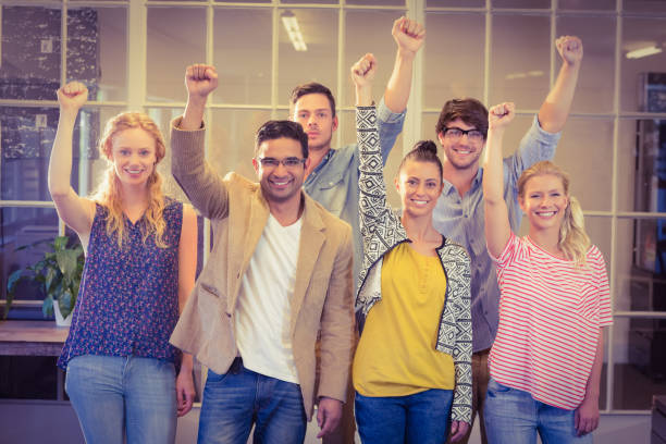 istock Business people cheering at the camera 813533458