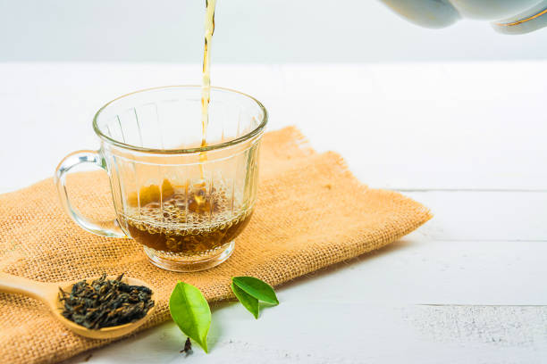 istock tea with  Tea glass on white wood 813533466