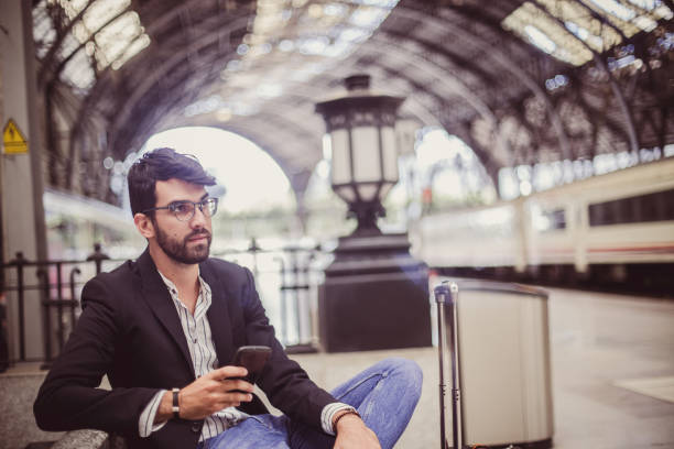 istock Businessman on train station 813536026