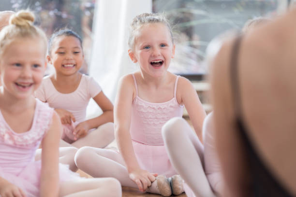 istock Young ballerinas laugh in class 813537838