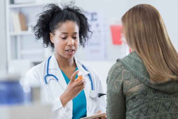 istock Female doctor talks with patient about medication side effects 813537928