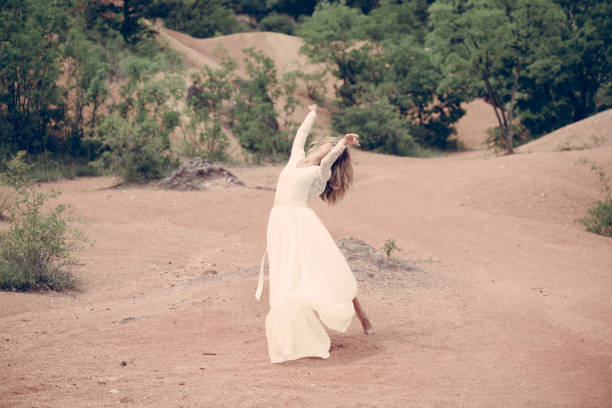 istock Beautiful bride dancing outdoor 813559942