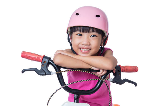 asian chinese little girl riding bicycle - helmet bicycle little girls child imagens e fotografias de stock