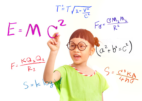 Little girl genius working on a mathematical equation