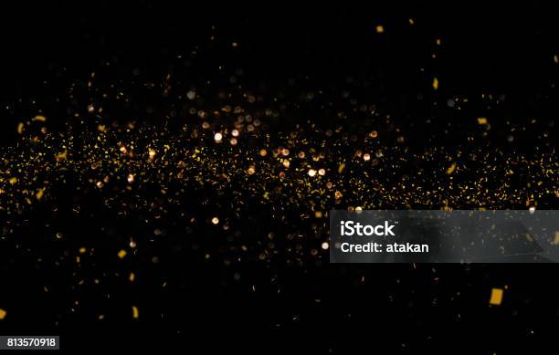 Waving Golden Glitter And Confetti Stock Photo - Download Image Now - Gold - Metal, Glittering, Gold Colored