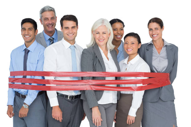 istock Smiling business people surrounding by red strip 813577956
