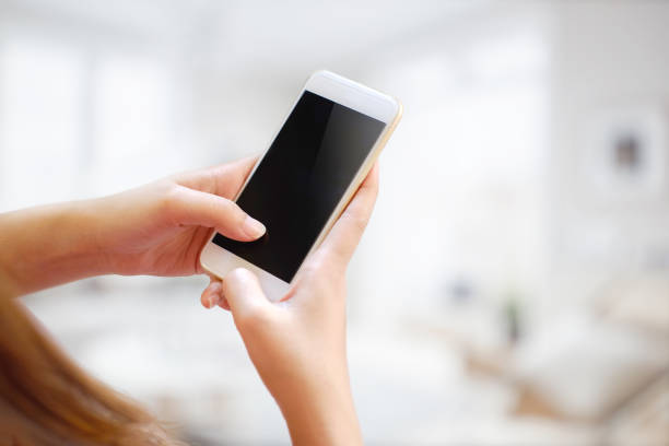 istock Young woman using smartphone on blur background. 813578036