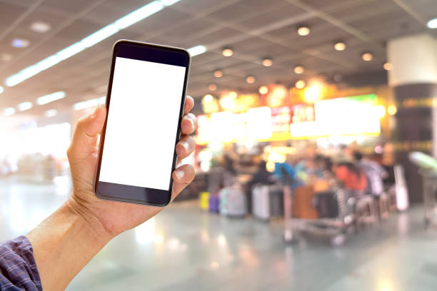 istock Man holding and using smartphone at check in terminal airport background. 813578066