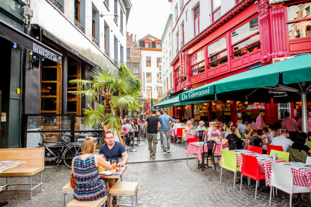 ANTWERPEN, BELGIUM - June 02, 2017: Street view with crowded cafes and restaurants at the center of the old town of Antwerpen city in Belgium