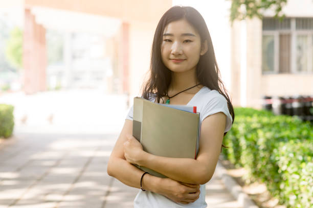 istock female asian college student on campus 813578416