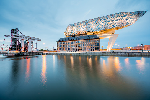 ANTWERPEN, BELGIUM - June 02, 2017: Night view on the illuminated Port House building designed by Zaha Hadid architect in 2009 in Antwerpen city, Belgium