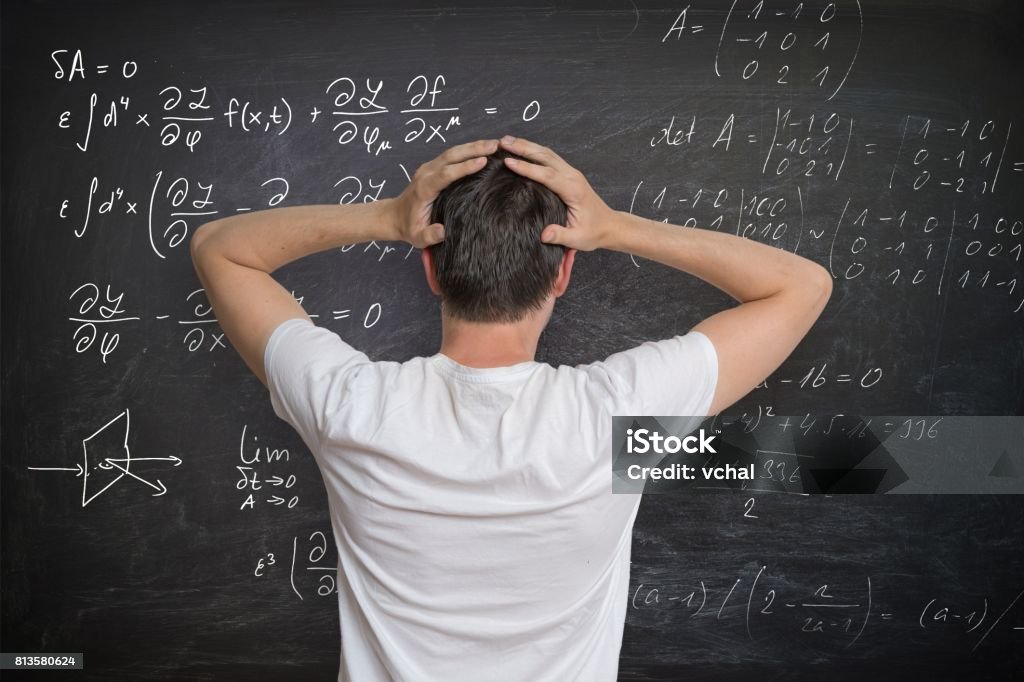 Man Solve Math Problems Young Man Is Solving Mathematical Problem On Blackboard And Is Confused ...