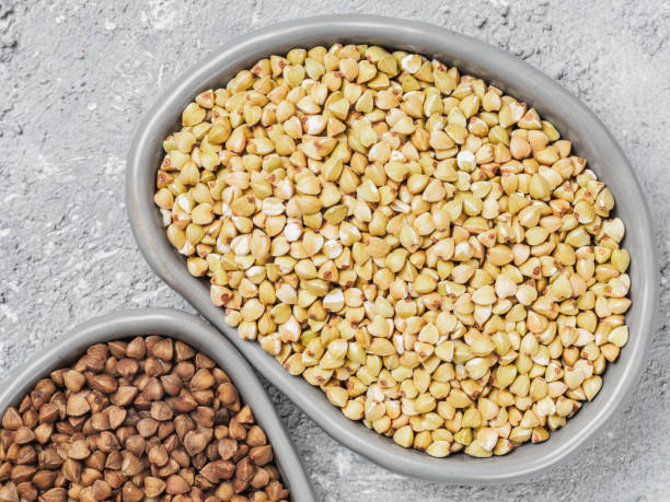 istock Raw green buckwheat on gray background 813580718