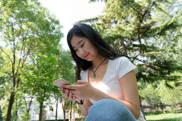 istock Beautiful girl chat on cell phones 813580738