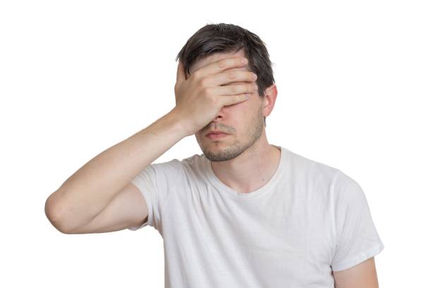 istock Young disappointed man isolated on white background. 813580802
