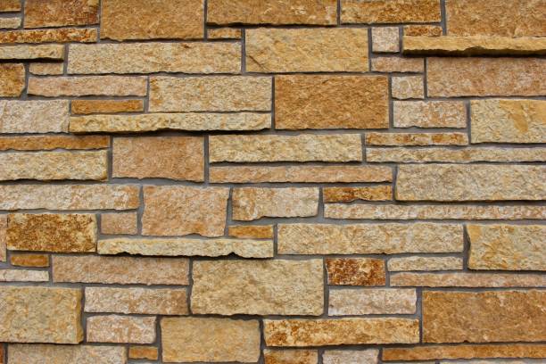 istock Golden Limestone Brick Wall Background 813580838