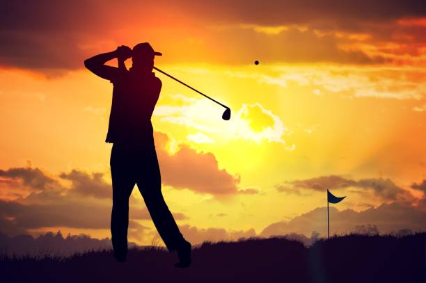 istock Silhouette of man playing golf at sunset. 813581344