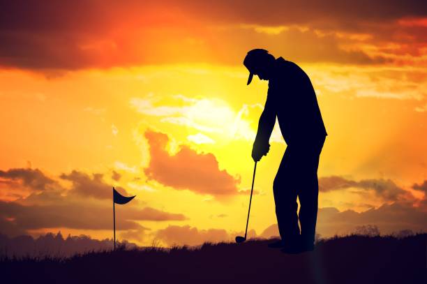 istock Silhouette of man playing golf at sunset. 813581352