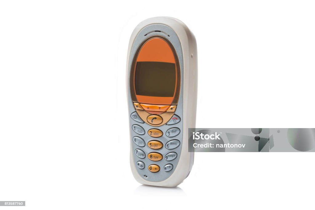 Old retro mobile phone isolated on white background Old retro mobile phone isolated on white background. 1990 Stock Photo