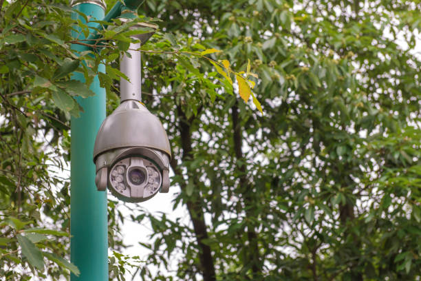 istock Security CCTV camera and urban video at public park 813588538