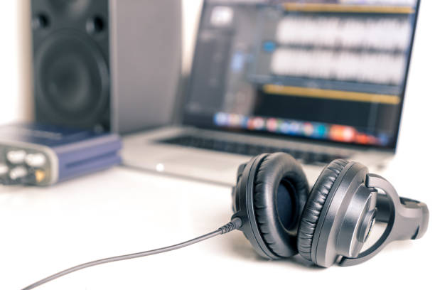 istock Black studio headphone in DAW music studio laptop 813598122