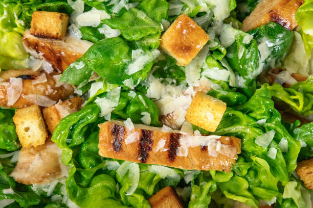 istock Closeup of chicken Caesar salad, overhead shot 813604542