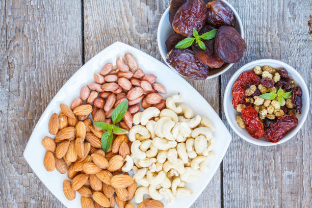 istock Different types of nuts and dried fruits. 813606936