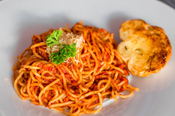 istock Close-up of a traditional spaghetti bolognese on a white plate 813607724
