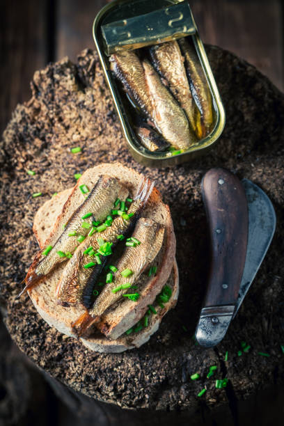 istock Sandwich with sardines, wholegrain bread and chive 813607778
