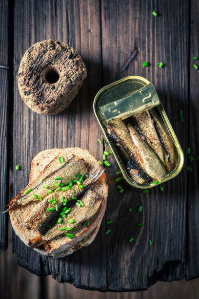 istock Fresh sandwich with sardines, wholegrain bread and chive 813613214