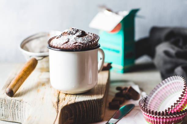 istock Homemade muffin and ingredients on cutting board over grey concrete background 813619062