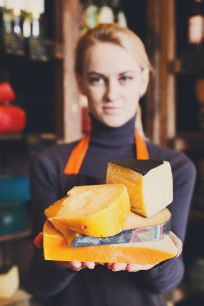istock Various italian hard cheese in shop assistant hands 813621778