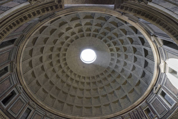 istock Dome of the Pantheon. Inside view.  Ray of sunlight passing through a hole in the ceiling. Pantheon was built as a temple to all the gods of ancient Rome. Rome, Italy. June 2017 813624768