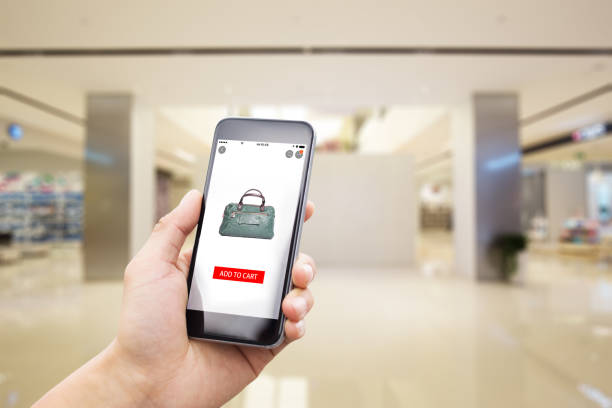 istock mobile phone with modern shopping mall 813625276