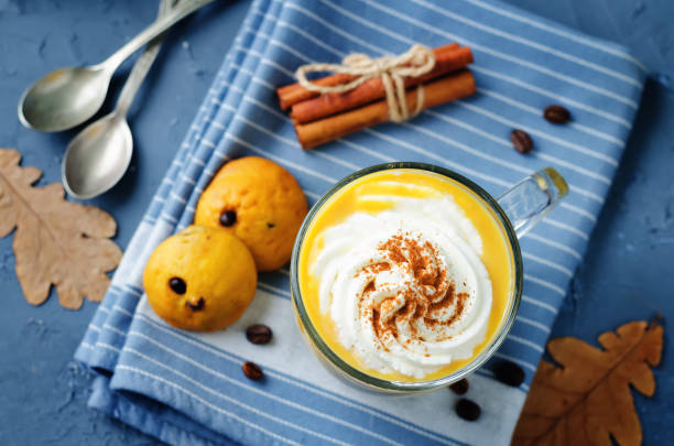 istock Pumpkin spice latte with whipped cream and pumpkin chocolate chips cookies 813625410