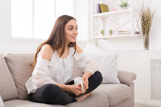 istock Surprised girl at home with coffee cup 813628606