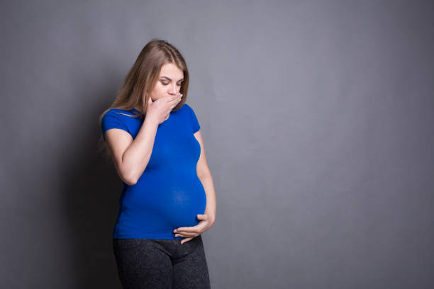 istock Young vomiting woman portrait 813638520
