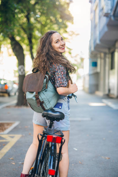 istock Young student girl on her bike 813641414