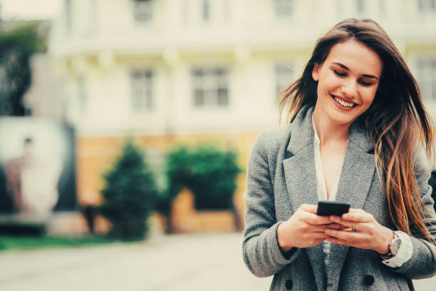 istock Woman texting in the city 813648140