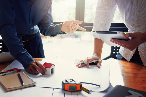 istock Team of engineers working together in a architect office. 813648496