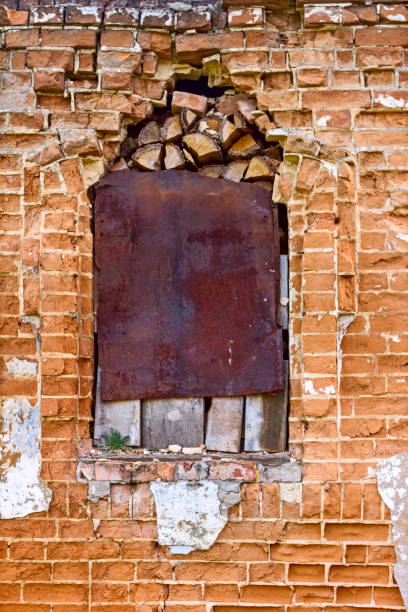 istock Old ancient window with old grunge brick wall